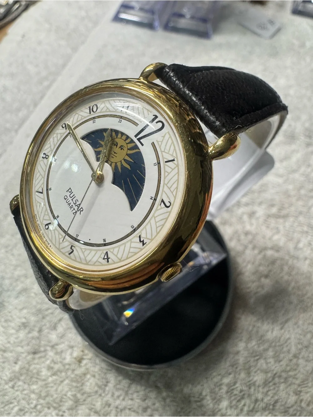 Pulsar Gold Tone Watch with White Dial and Black Strap